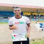 Photo: 'Zlatan' Ediae strikes a pose with his Man-Of-The-Match certificate award at the Agbor township stadium.

